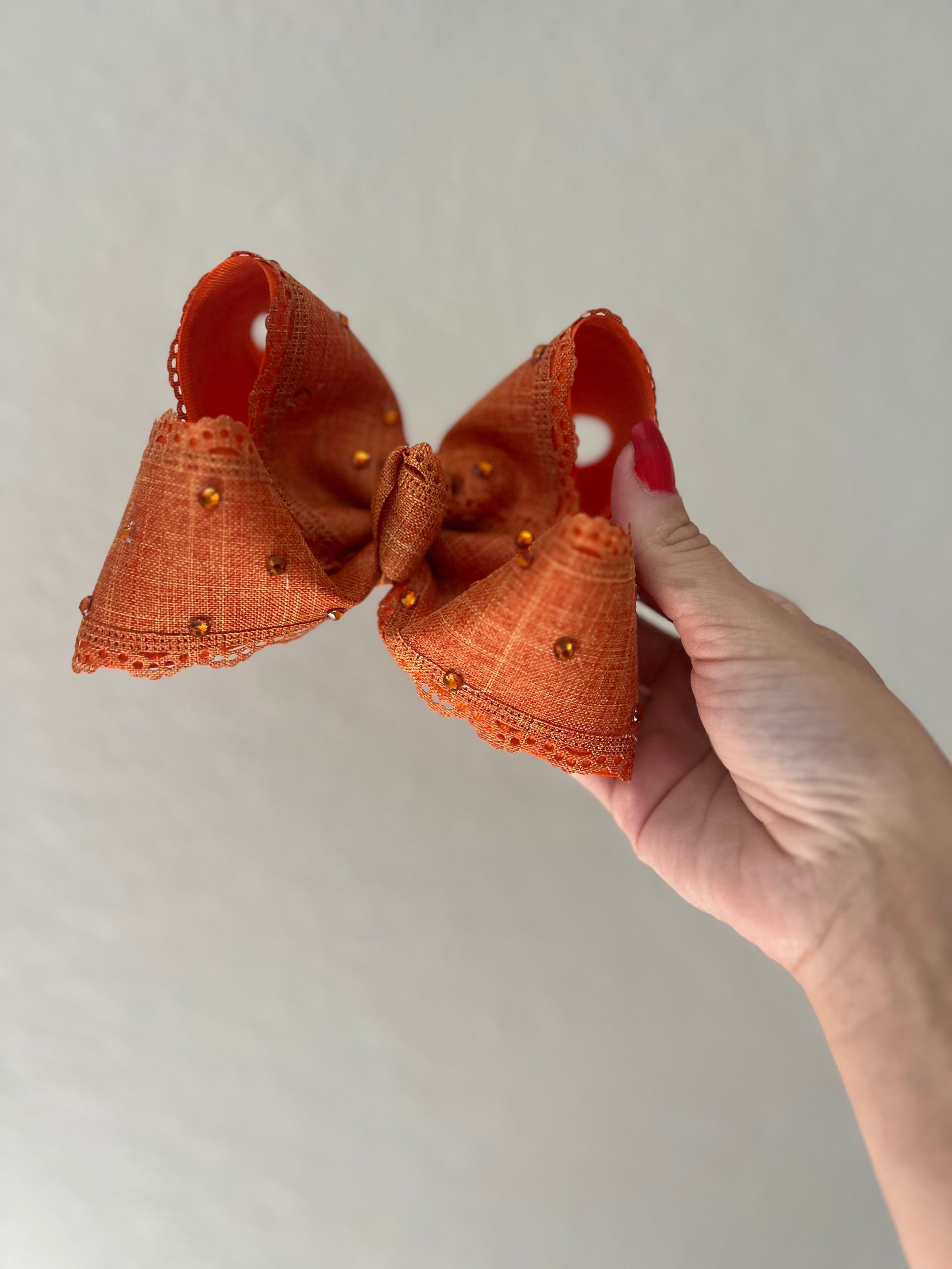 5” burnt orange rhinestone on clip