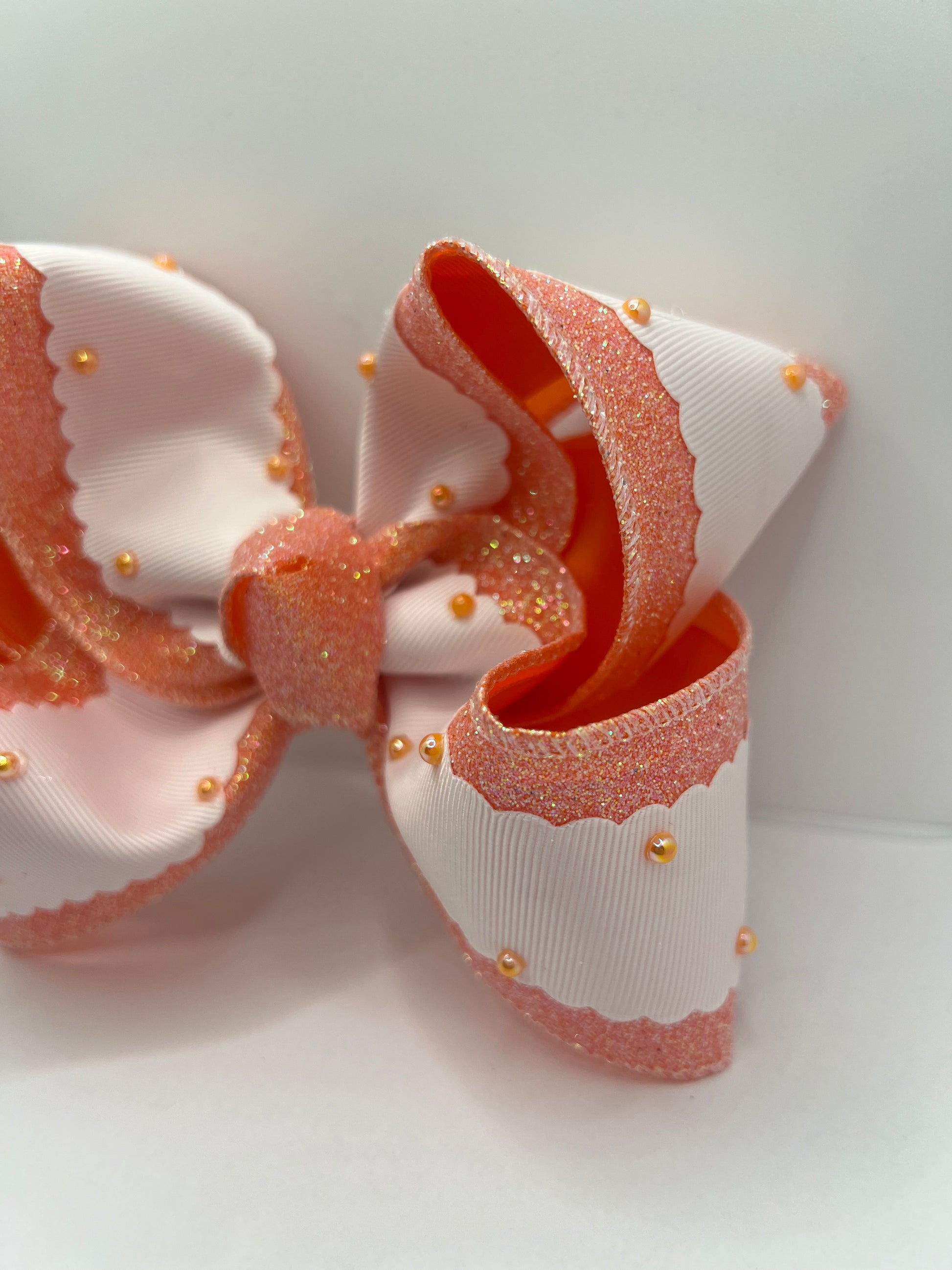 5 1/2” peach pearls on clip